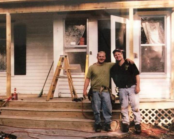 Lee and Eric Juvland working on a house in the very beginning of the business