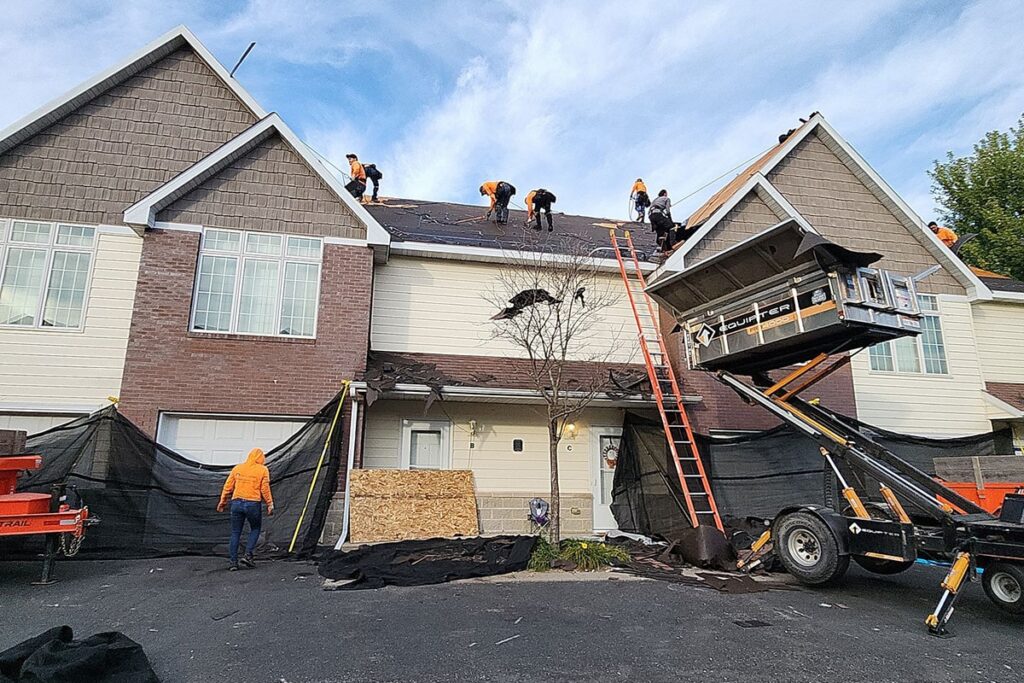 the kingdom builders roofers on roof of student housing