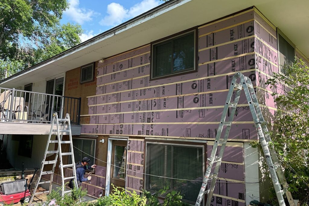 adding layer of insulation to exterior of home