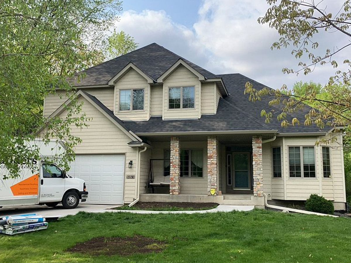 new roof and gutters on crown drive minnetonka home