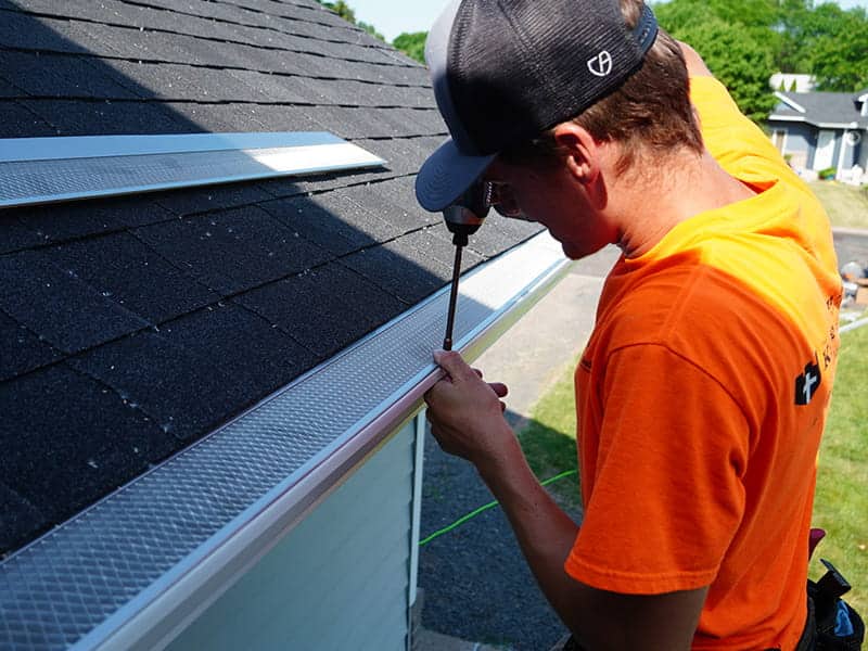 tkb employee installing leafblaster pro on home