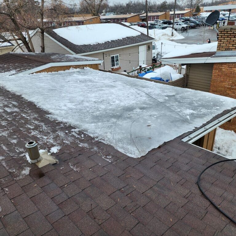 A large ice dam on a church roof in Hopkins, MN